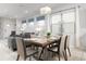 Dining area with a modern wooden table and gray chairs at 9009 Rhodes St, Kissimmee, FL 34747