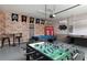 Game room with foosball table, pool table, and themed decor at 9009 Rhodes St, Kissimmee, FL 34747