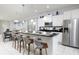Modern kitchen with white cabinets, an island, and stainless steel appliances at 9009 Rhodes St, Kissimmee, FL 34747