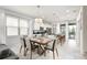 Modern kitchen with white cabinets, a breakfast bar, and stainless steel appliances at 9009 Rhodes St, Kissimmee, FL 34747