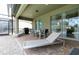 Covered patio with seating, grill, and pool access at 9009 Rhodes St, Kissimmee, FL 34747