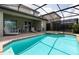 Inviting pool and spa with a covered patio and outdoor furniture at 9009 Rhodes St, Kissimmee, FL 34747