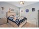 Spacious bedroom with a bed, nightstand, and decorative wall at 931 Kylee Aly, Winter Garden, FL 34787
