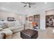 Bright bonus room features a cozy seating area and workspace at 931 Kylee Aly, Winter Garden, FL 34787