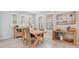 Dining area features a rustic wooden table with seating for four at 931 Kylee Aly, Winter Garden, FL 34787