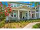 Charming two-story home with a welcoming front porch and lush landscaping at 931 Kylee Aly, Winter Garden, FL 34787