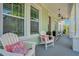 Relaxing front porch with white adirondack chairs and colorful pillows at 931 Kylee Aly, Winter Garden, FL 34787