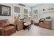 Spacious home office with leather chair and large windows at 931 Kylee Aly, Winter Garden, FL 34787