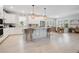Modern kitchen with white cabinets, an island, and stainless steel appliances at 931 Kylee Aly, Winter Garden, FL 34787