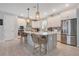 Modern kitchen with white cabinets and large island at 931 Kylee Aly, Winter Garden, FL 34787
