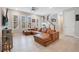 Spacious living area with a large sectional sofa and hardwood floors at 931 Kylee Aly, Winter Garden, FL 34787