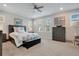 Spacious bedroom with plush carpeting and large windows at 931 Kylee Aly, Winter Garden, FL 34787