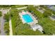 Community pool with lounge chairs and surrounding landscaping at 931 Kylee Aly, Winter Garden, FL 34787