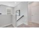 Upstairs hallway with neutral walls and carpet at 931 Kylee Aly, Winter Garden, FL 34787