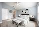 Spacious bedroom with light walls, wood flooring and ensuite bathroom at 10050 Hidden Dunes Ln, Orlando, FL 32832