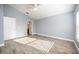 Main bedroom with gray walls, tile floors, and ceiling fan at 10050 Hidden Dunes Ln, Orlando, FL 32832