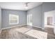 Bedroom with gray walls, tile floor, and sliding door to backyard at 10050 Hidden Dunes Ln, Orlando, FL 32832