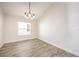 Dining area with tile floor and large window, well lit at 10050 Hidden Dunes Ln, Orlando, FL 32832