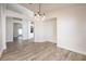 Bright dining room with tile flooring and modern light fixture at 10050 Hidden Dunes Ln, Orlando, FL 32832