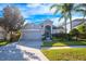 Charming one-story home with gray exterior, landscaped lawn, and attached garage at 10050 Hidden Dunes Ln, Orlando, FL 32832