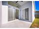 Covered patio with sliding glass doors at 10050 Hidden Dunes Ln, Orlando, FL 32832