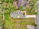 An overhead aerial view of a single story house with a gray roof and a yard at 1104 W 3Rd Street, Sanford, FL 32771