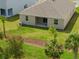 An aerial view of the backyard featuring a covered patio and landscaping at 1123 Happy Forest Loop, Deland, FL 32720
