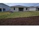 Newly constructed home with a large backyard and mulch beds at 1123 Happy Forest Loop, Deland, FL 32720