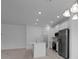Bright kitchen featuring stainless steel appliances, a kitchen island, and an open concept design at 1123 Happy Forest Loop, Deland, FL 32720
