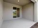 Covered patio with concrete floor and sliding glass door at 1123 Happy Forest Loop, Deland, FL 32720