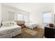 Spacious bedroom with two twin beds, a rug, and large windows at 11618 Vinci Dr, Windermere, FL 34786