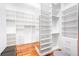 Large walk-in closet with ample shelving and drawers at 11618 Vinci Dr, Windermere, FL 34786