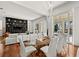 Modern dining room with glass table and lake views at 11618 Vinci Dr, Windermere, FL 34786