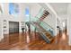 Grand entryway with modern staircase and hardwood floors at 11618 Vinci Dr, Windermere, FL 34786