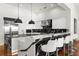 Modern kitchen island with white cabinetry and breakfast bar at 11618 Vinci Dr, Windermere, FL 34786