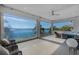 Expansive lakefront patio with stunning water views and comfortable seating at 11618 Vinci Dr, Windermere, FL 34786
