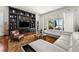 Spacious living room with white sectional sofa and built-in shelving at 11618 Vinci Dr, Windermere, FL 34786