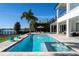 Luxury pool and spa with lake view; resort-style backyard oasis at 11618 Vinci Dr, Windermere, FL 34786