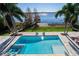Inviting pool and spa area with lake views and plenty of lounge space at 11618 Vinci Dr, Windermere, FL 34786