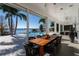 Covered patio overlooking the pool and lake at 11618 Vinci Dr, Windermere, FL 34786
