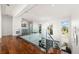 Modern upper hallway with hardwood floors and glass railings overlooking the main floor at 11618 Vinci Dr, Windermere, FL 34786