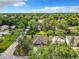 Single story home aerial view in wooded neighborhood at 120 Crooked Pine Rd, Port Orange, FL 32128