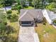 Single Gathering home with driveway and landscaped yard at 120 Crooked Pine Rd, Port Orange, FL 32128
