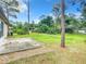 Spacious backyard with grassy area and patio, offering privacy at 120 Crooked Pine Rd, Port Orange, FL 32128