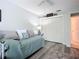 Charming bedroom with daybed, built-in closet, and natural light at 120 Crooked Pine Rd, Port Orange, FL 32128