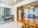Bright enclosed patio with table and chairs, offering extra living space at 120 Crooked Pine Rd, Port Orange, FL 32128