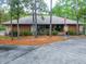 Community clubhouse features a welcoming entrance and landscaping at 120 Crooked Pine Rd, Port Orange, FL 32128