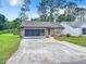Cute brick ranch home with screened garage at 120 Crooked Pine Rd, Port Orange, FL 32128