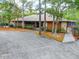 Community clubhouse with ample parking and landscaping at 120 Crooked Pine Rd, Port Orange, FL 32128