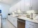 White kitchen with stainless steel appliances and an island at 120 Crooked Pine Rd, Port Orange, FL 32128